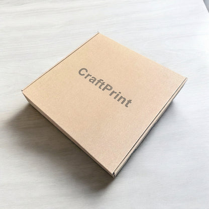 Brown cardboard box with 'Crafrpint' branding on a light gray surface